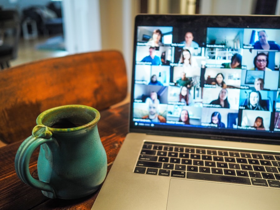 Laptop on a table showing a group video call